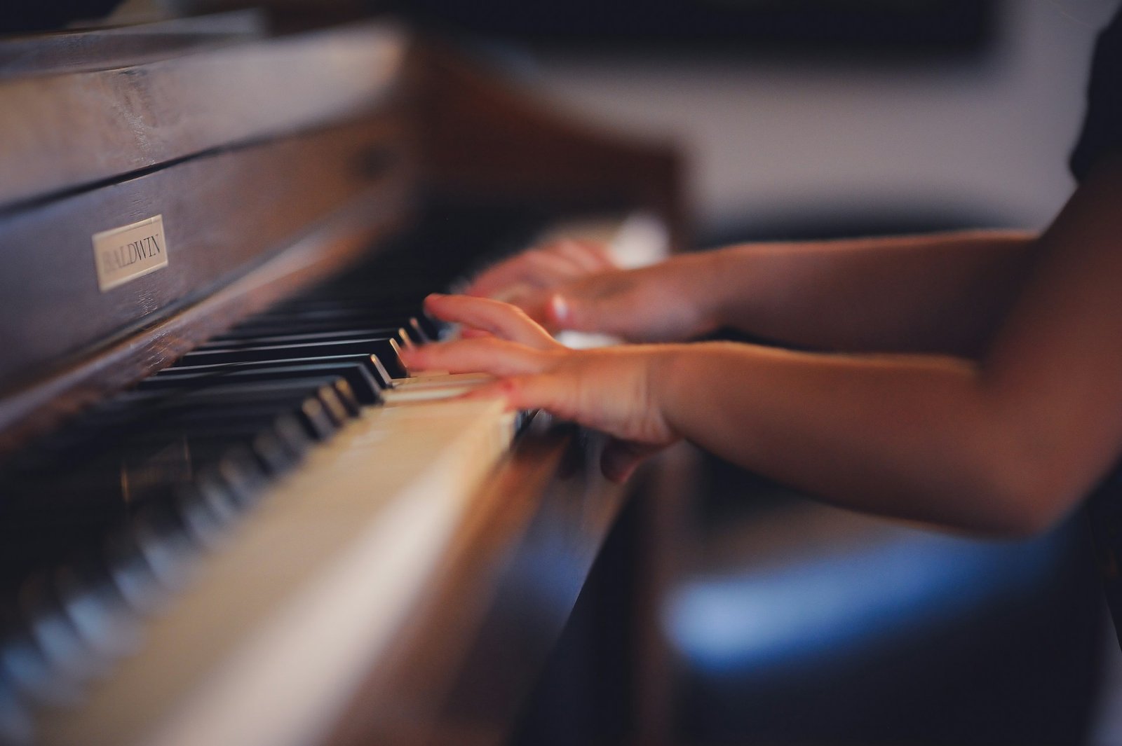 Hands playing piano